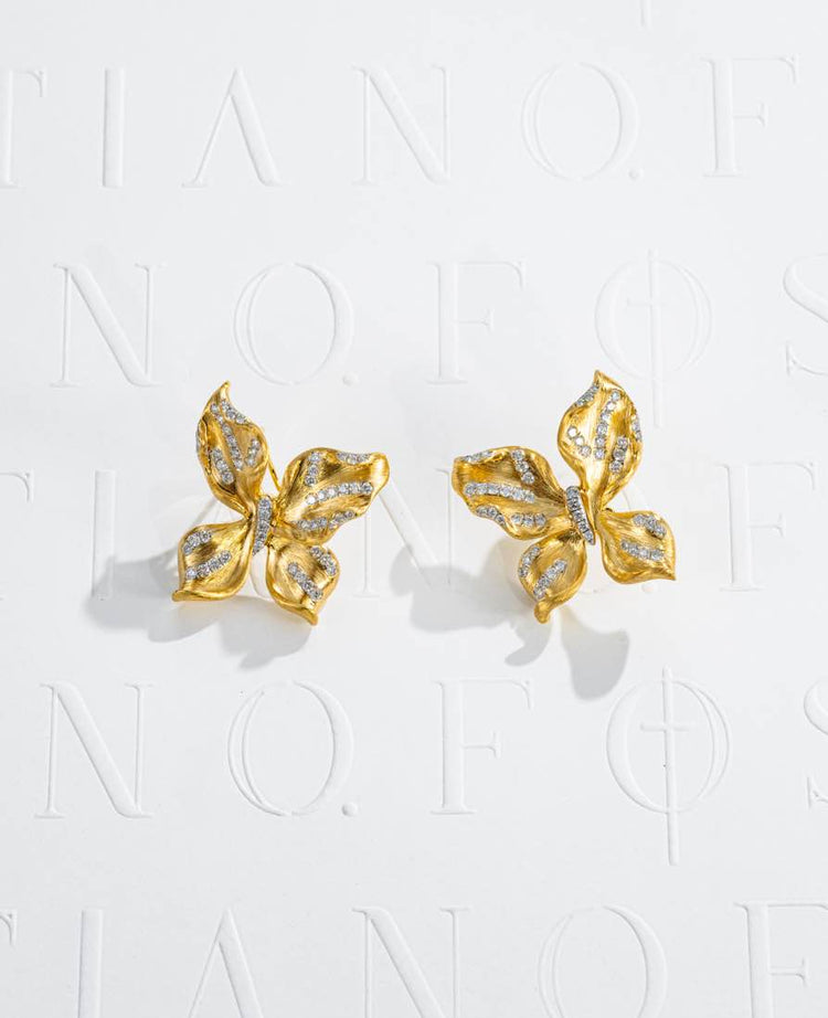 Fostiano Butterfly Bloom 18K gold earrings with natural diamonds, sculptural wing and petal forms and brushed texture