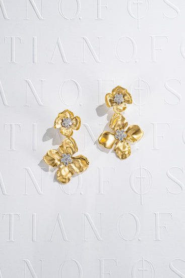 Fostiano 18K gold two-tier floral drop earrings with brushed sculptural petals and natural white diamond cluster centres