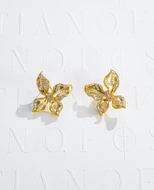 Fostiano Butterfly Bloom 18K gold earrings with natural diamonds, sculptural wing and petal forms and brushed texture