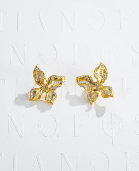 Fostiano Butterfly Bloom 18K gold earrings with natural diamonds, sculptural wing and petal forms and brushed texture